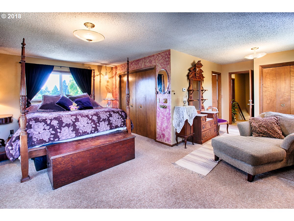 36980 Southeast Hauglum Road Sandy, OR 97055 - Photo 12 of 31 a bedroom with a bed and a couch