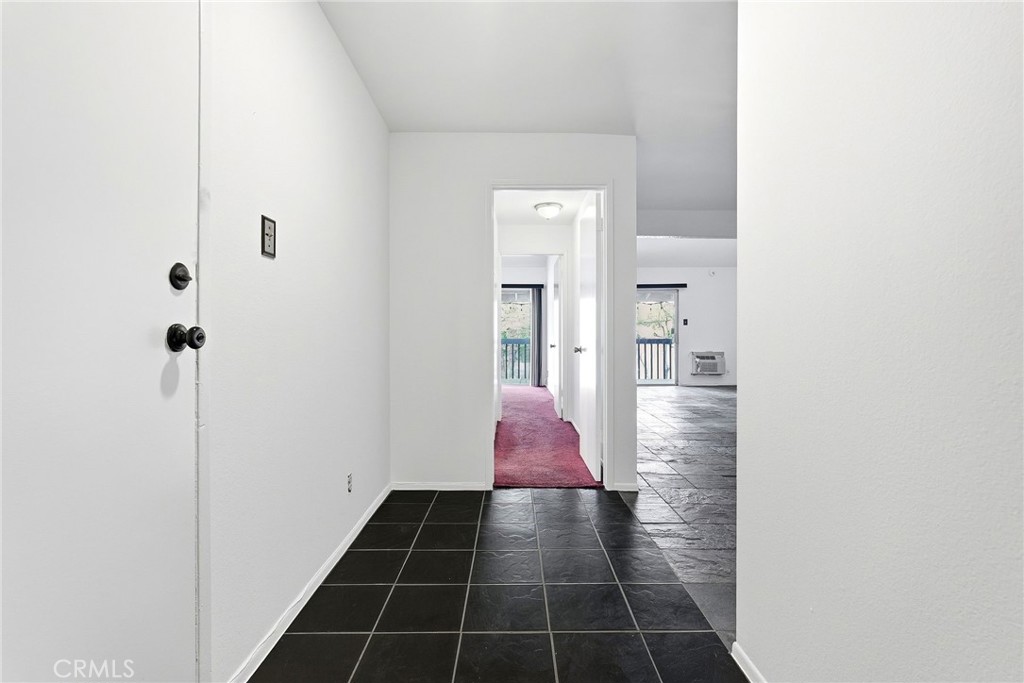 7890 East Spring Street, Unit 11E Long Beach, CA 90815 - Photo 9 of 40 a bathroom with a glass shower door
