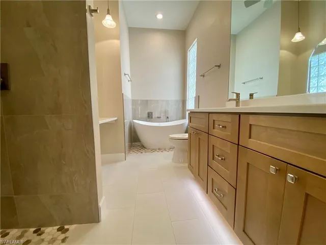 a en suite bathroom with a sink and a mirror