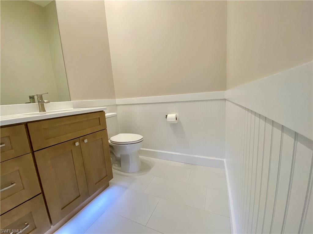 2740 Island Pond Lane Naples, FL 34119 - Photo 16 of 43 a bathroom with a sink and a toilet