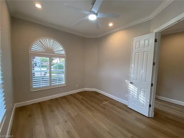 a bathroom with a granite countertop shower a toilet and a sink