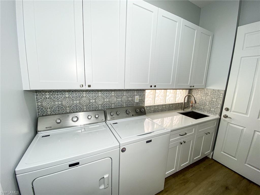 2740 Island Pond Lane Naples, FL 34119 - Photo 22 of 43 a utility room with sink dryer and washer