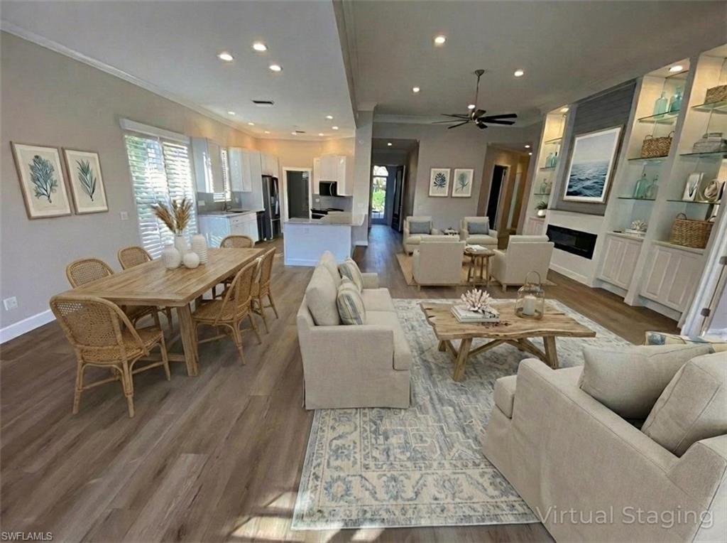 2740 Island Pond Lane Naples, FL 34119 - Photo 32 of 43 a living room with furniture and a table
