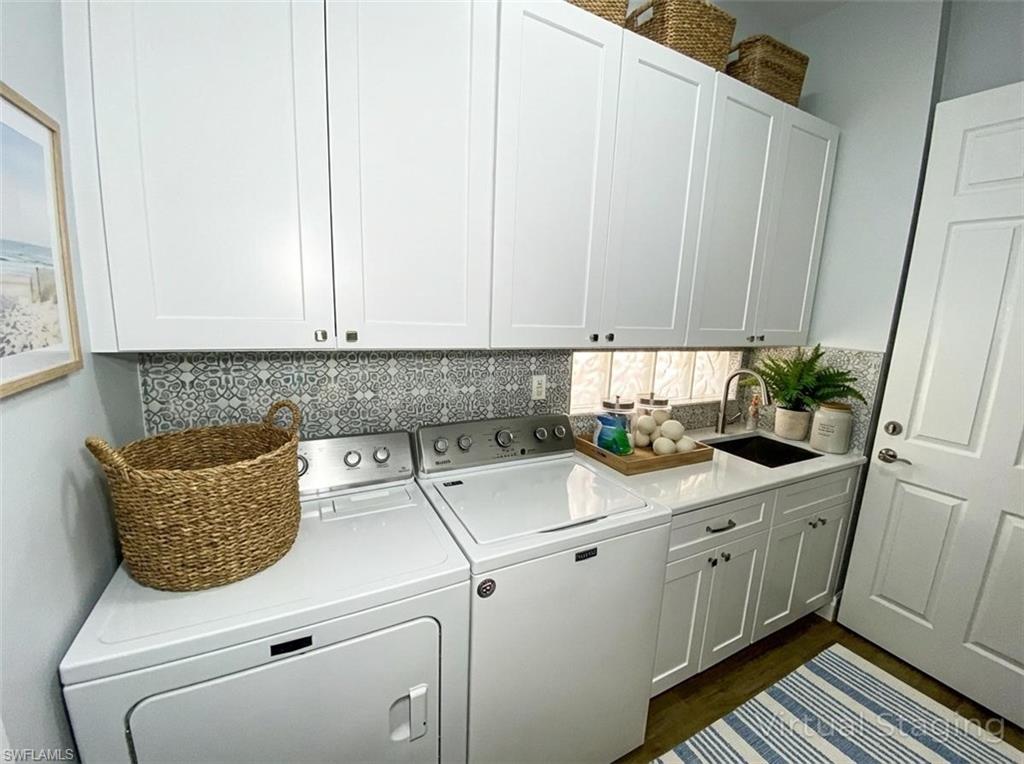 2740 Island Pond Lane Naples, FL 34119 - Photo 38 of 43 a utility room with closet a stove and a window