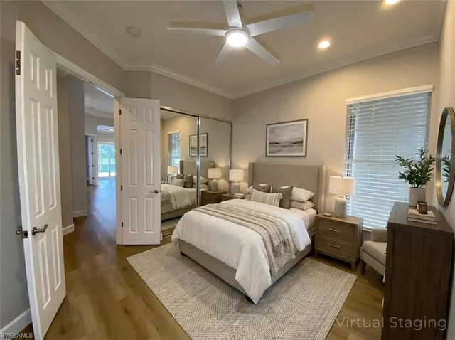 a utility room with closet a stove and a window