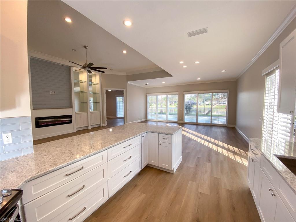 2740 Island Pond Lane Naples, FL 34119 - Photo 42 of 43 a large bathroom with double vanity and a large window
