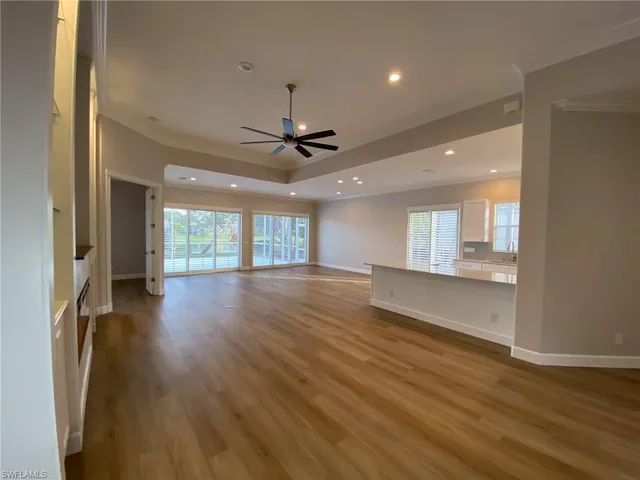 a kitchen with stainless steel appliances granite countertop a refrigerator a sink and a granite counter tops