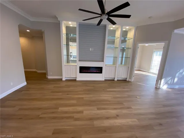 a kitchen with granite countertop white cabinets and stainless steel appliances