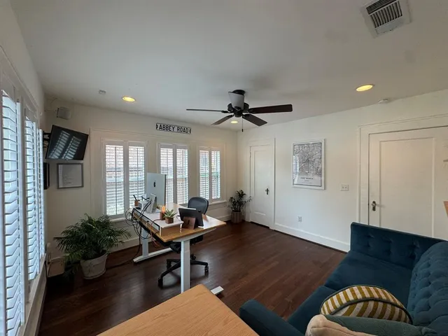a living room with furniture and windows