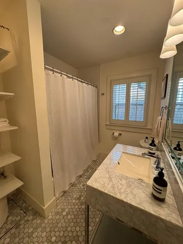 a bathroom with a sink and a mirror