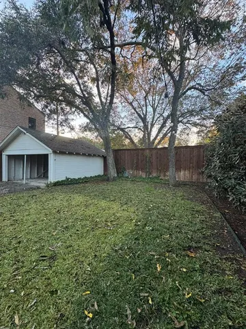 a view of a house with a back yard