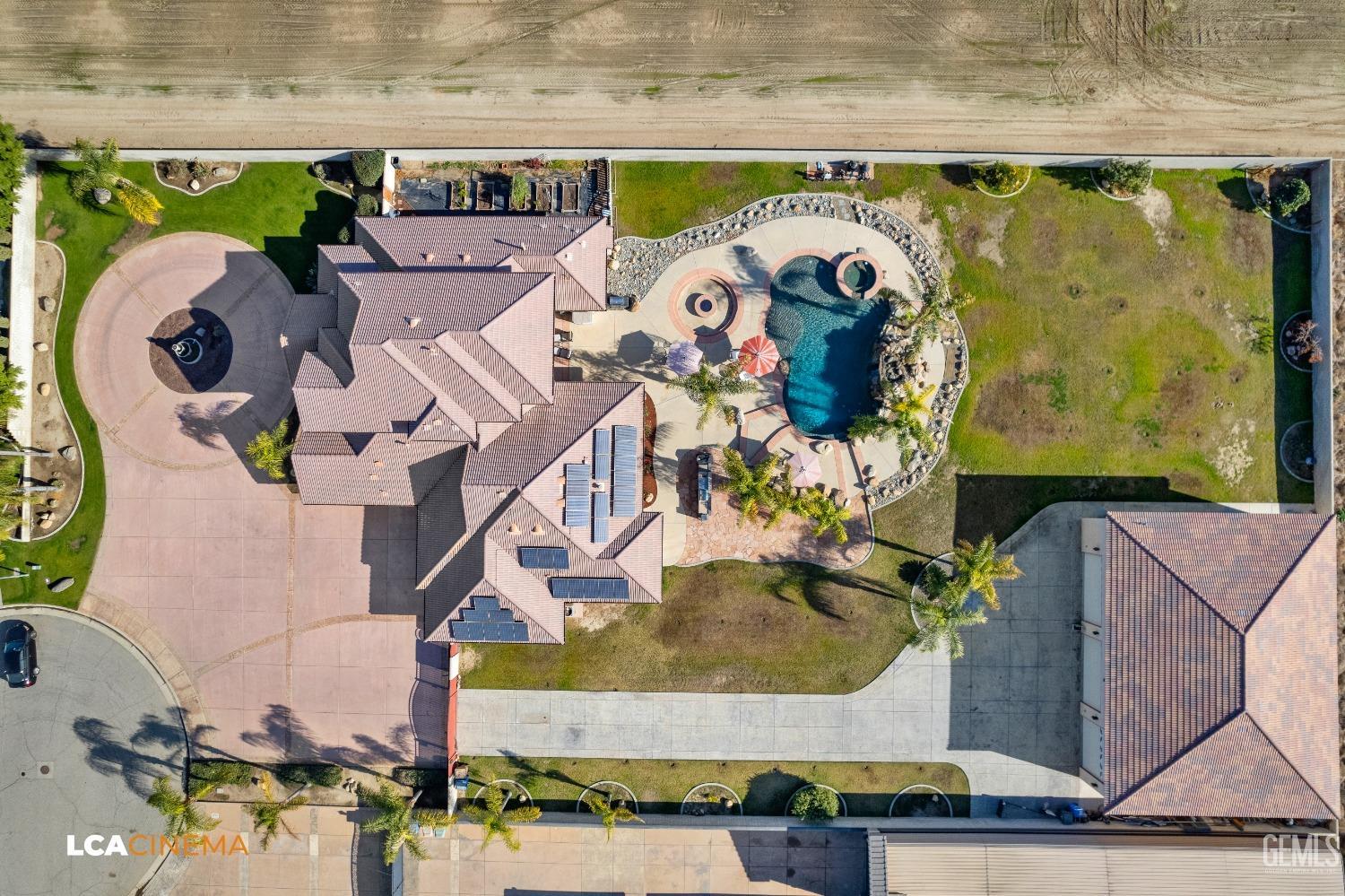 Undisclosed Address Bakersfield, CA 93314 - Photo 26 of 71 an aerial view of a house with a swimming pool