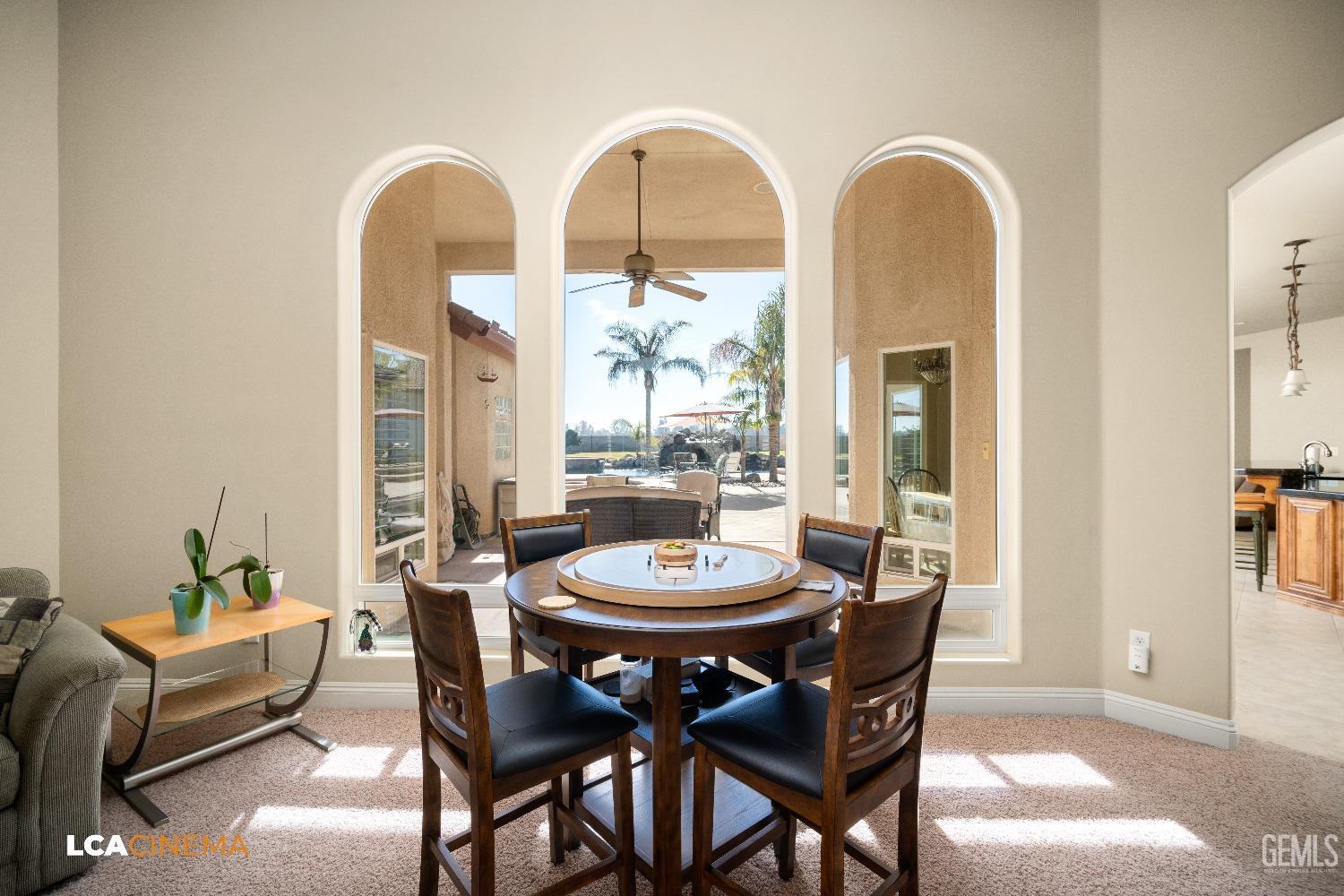 Undisclosed Address Bakersfield, CA 93314 - Photo 34 of 71 a view of a dining room with furniture and a potted plant