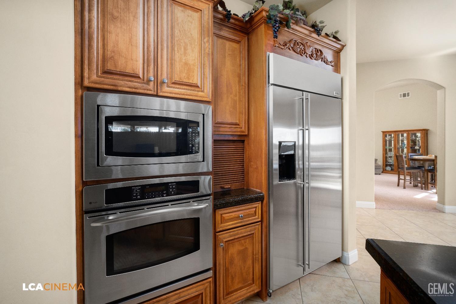 Undisclosed Address Bakersfield, CA 93314 - Photo 38 of 71 a kitchen with granite countertop cabinets stainless steel appliances and a counter top space