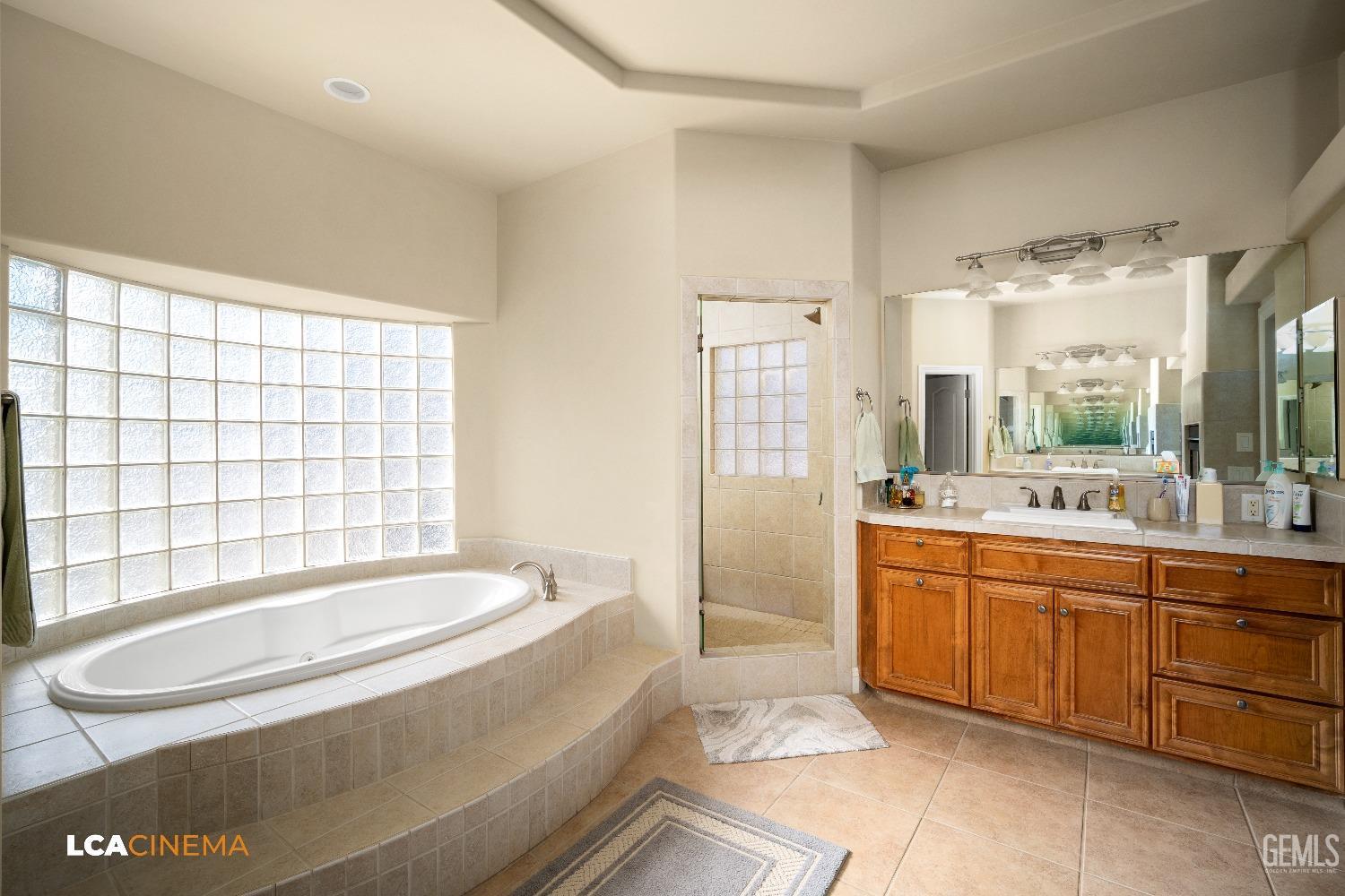 Undisclosed Address Bakersfield, CA 93314 - Photo 42 of 71 a spacious bathroom with sink shower and bathtub