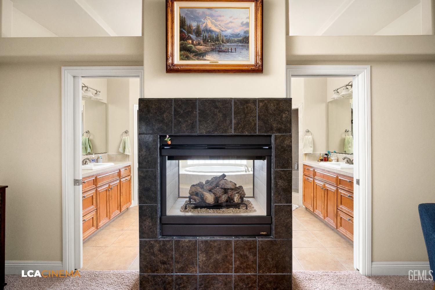 Undisclosed Address Bakersfield, CA 93314 - Photo 43 of 71 a hallway with a fireplace and cabinets