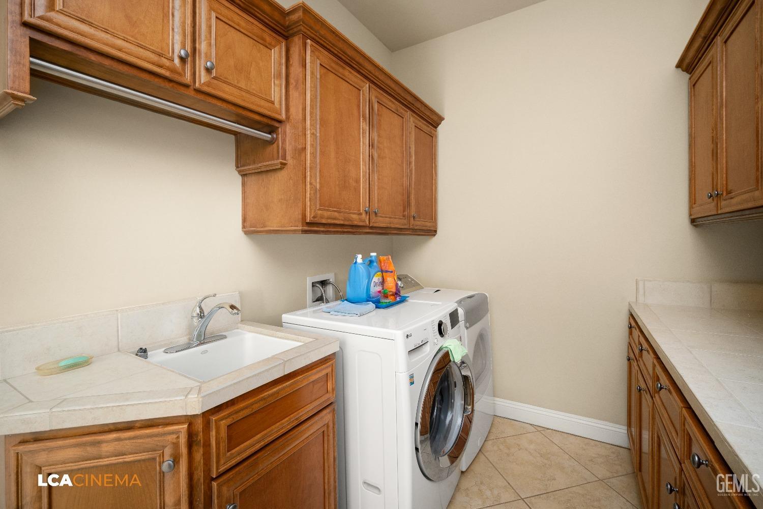 Undisclosed Address Bakersfield, CA 93314 - Photo 46 of 71 a utility room with dryer and washer