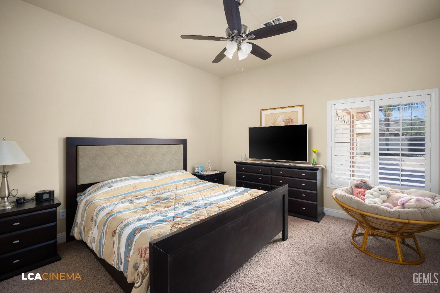 Undisclosed Address Bakersfield, CA 93314 - Photo 48 of 71 a bedroom with a bed and a flat screen tv