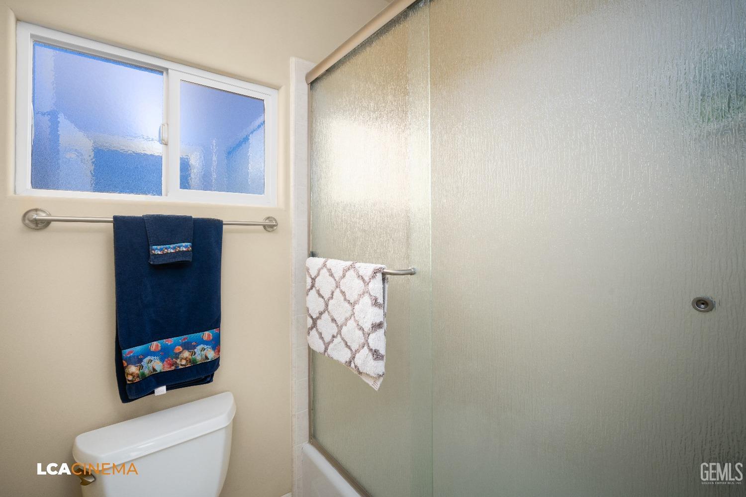 Undisclosed Address Bakersfield, CA 93314 - Photo 50 of 71 a bathroom with a toilet a sink and a shower