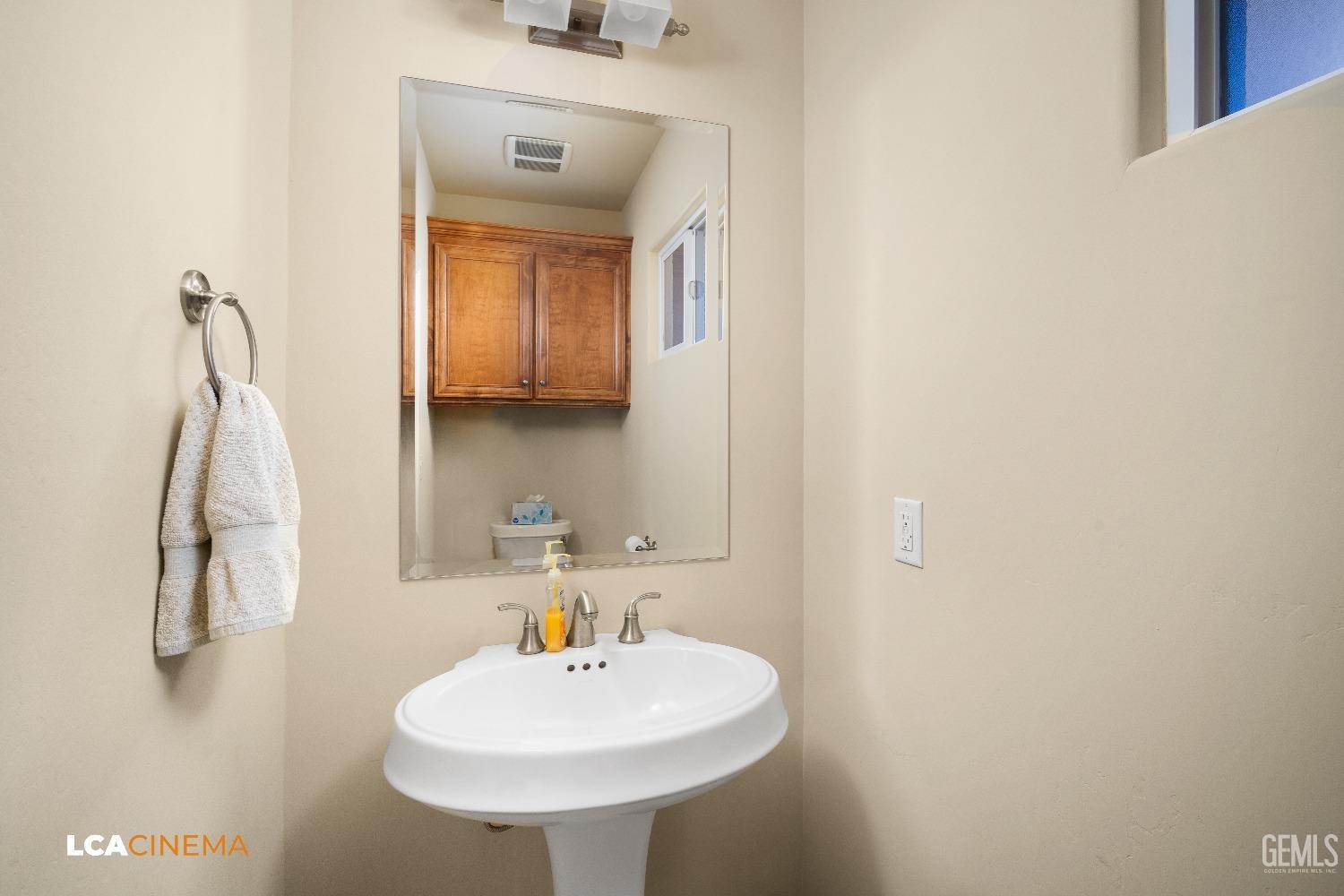Undisclosed Address Bakersfield, CA 93314 - Photo 52 of 71 a bathroom with a sink and a mirror