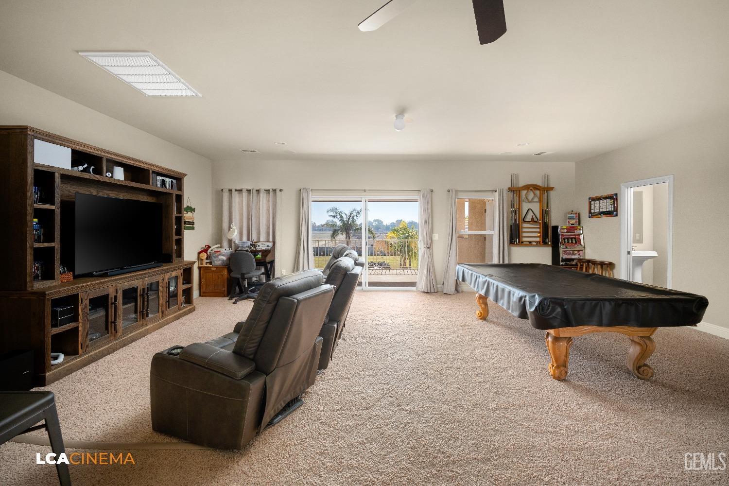 Undisclosed Address Bakersfield, CA 93314 - Photo 53 of 71 a living room with furniture and a flat screen tv
