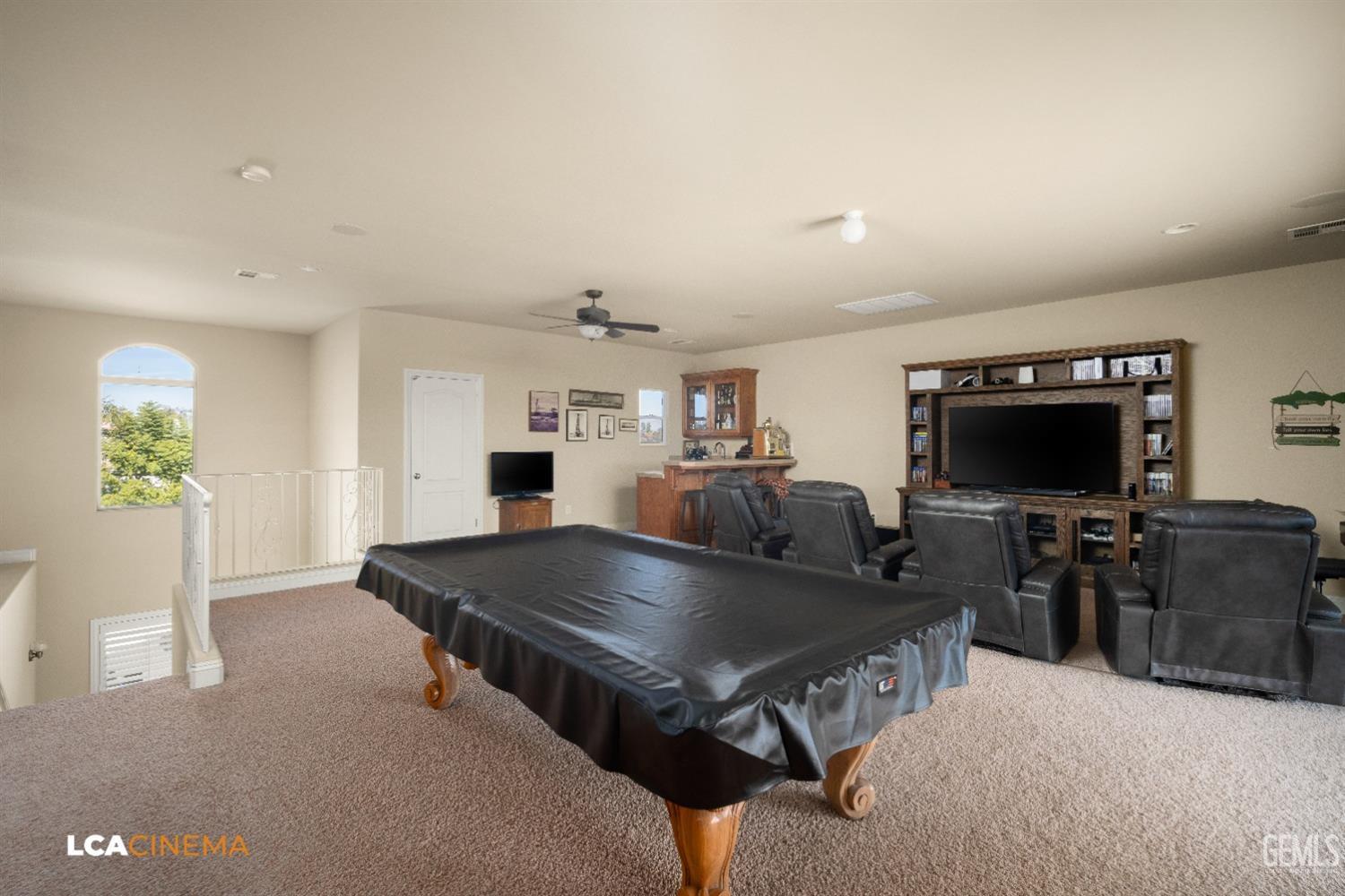 Undisclosed Address Bakersfield, CA 93314 - Photo 55 of 71 a living room with furniture and a flat screen tv