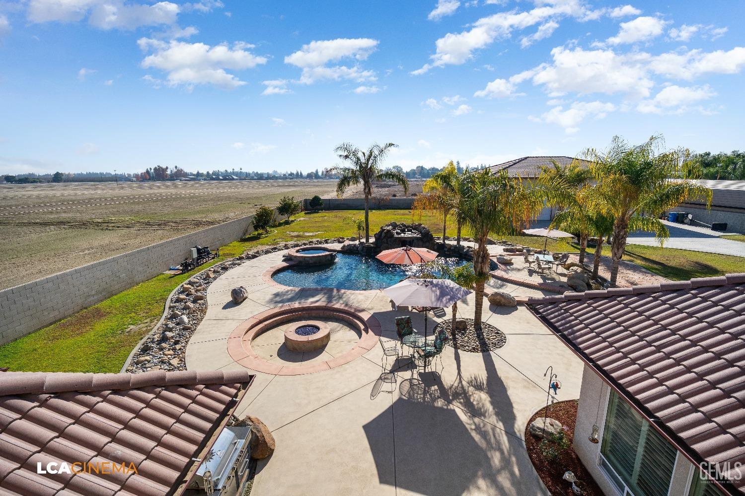 Undisclosed Address Bakersfield, CA 93314 - Photo 57 of 71 a view of a swimming pool with outdoor seating and city view