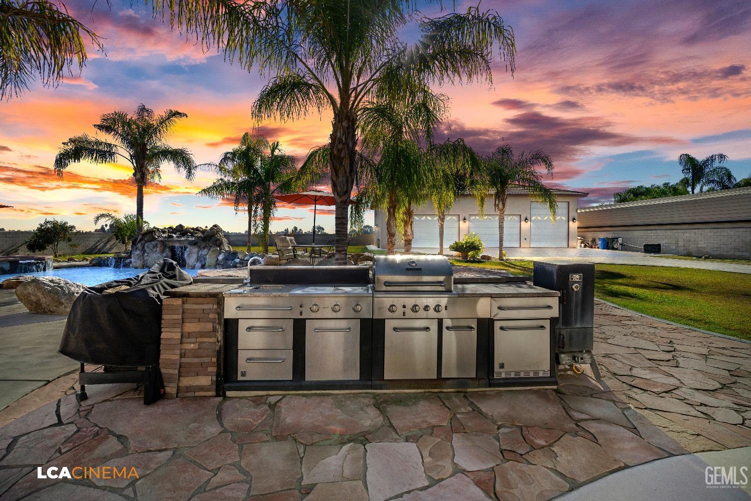 Undisclosed Address Bakersfield, CA 93314 - Photo 7 of 71 a white house with a table and chairs in a patio