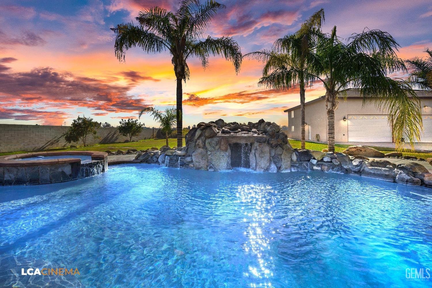 Undisclosed Address Bakersfield, CA 93314 - Photo 9 of 71 a view of swimming pool with a table and chairs