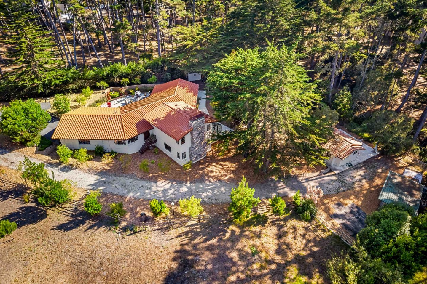 1268 Viscaino Road Pebble Beach, CA 93953 - Photo 1 of 47 an aerial view of a house with a yard
