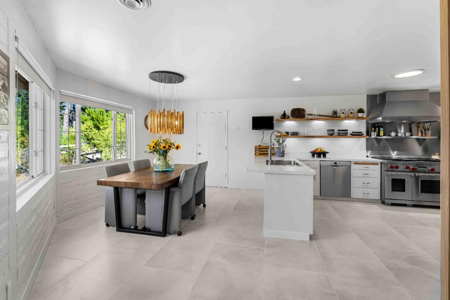 1268 Viscaino Road Pebble Beach, CA 93953 - Photo 17 of 47 a living room with stainless steel appliances furniture and a kitchen view