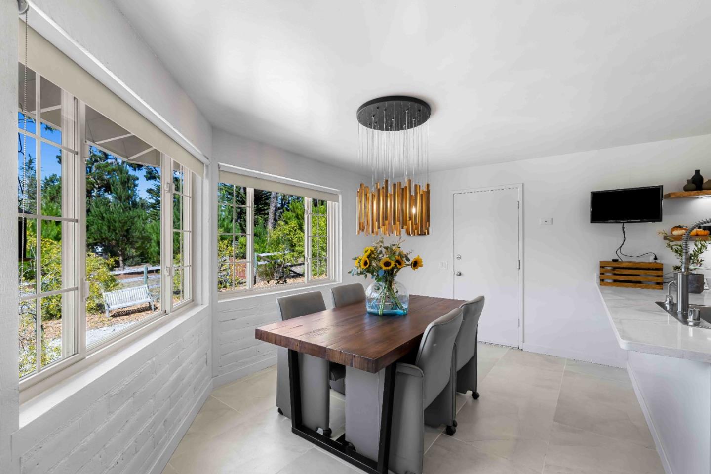 1268 Viscaino Road Pebble Beach, CA 93953 - Photo 18 of 47 a view of a workspace with furniture and a window