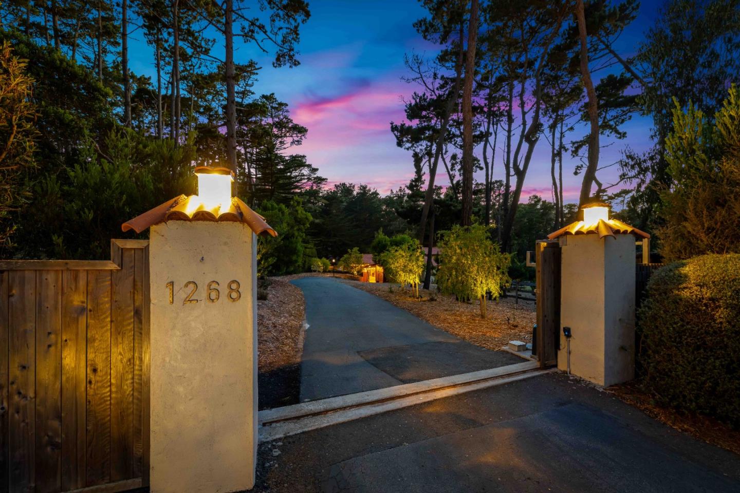 1268 Viscaino Road Pebble Beach, CA 93953 - Photo 2 of 47 a view of a street with a building in the background