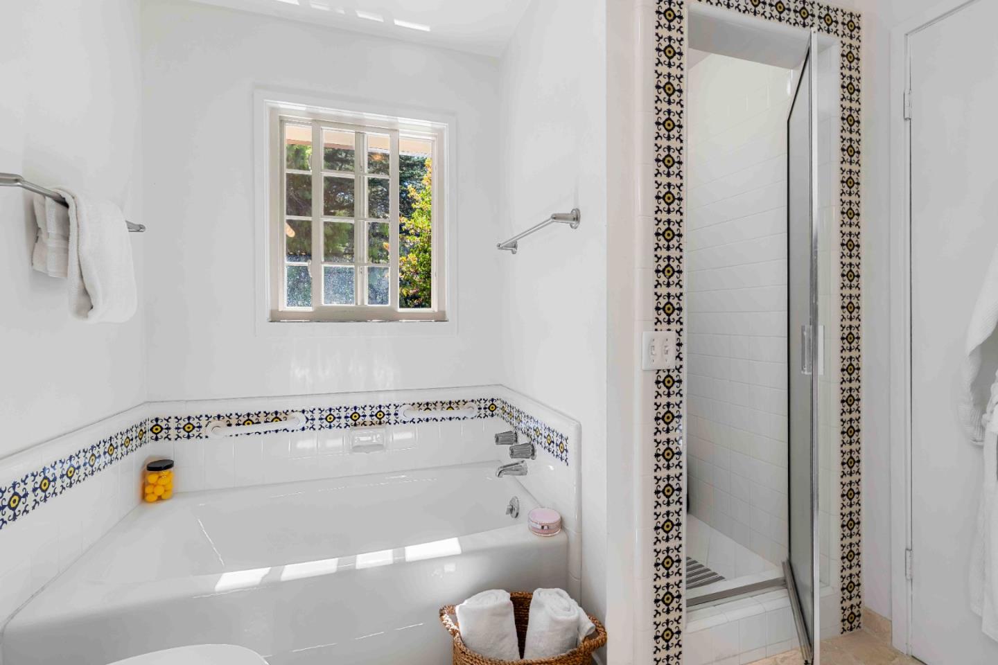 1268 Viscaino Road Pebble Beach, CA 93953 - Photo 24 of 47 a bathroom with a bathtub and a window