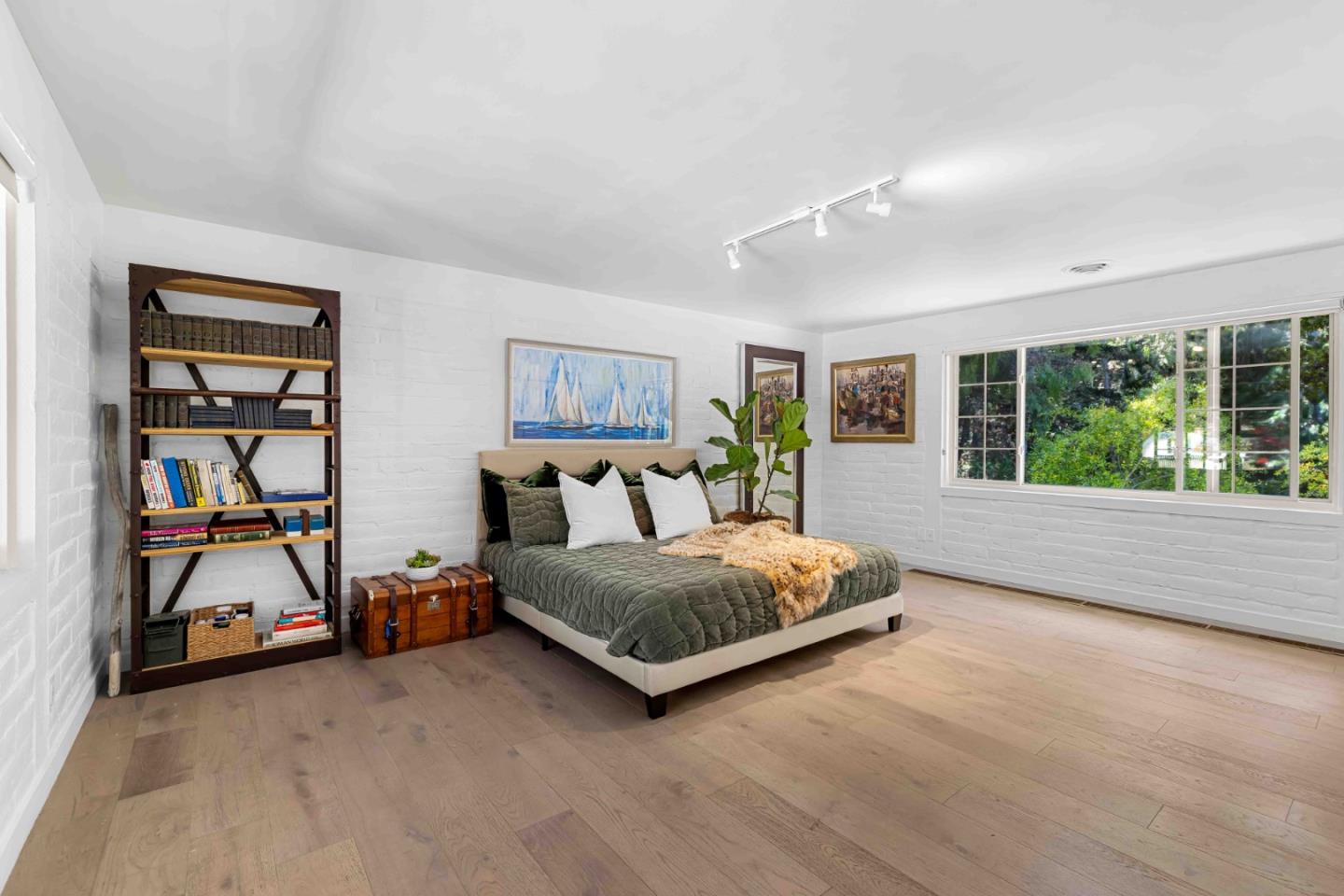1268 Viscaino Road Pebble Beach, CA 93953 - Photo 25 of 47 a living room with a bed and a window