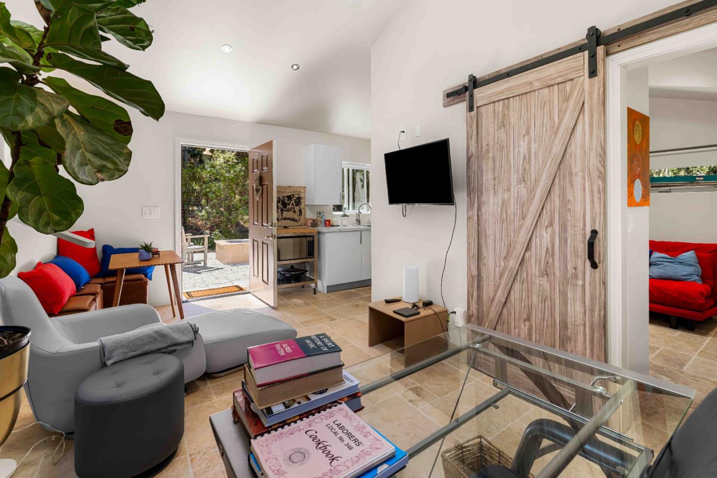1268 Viscaino Road Pebble Beach, CA 93953 - Photo 29 of 47 a living room with furniture a flat screen tv and a large window