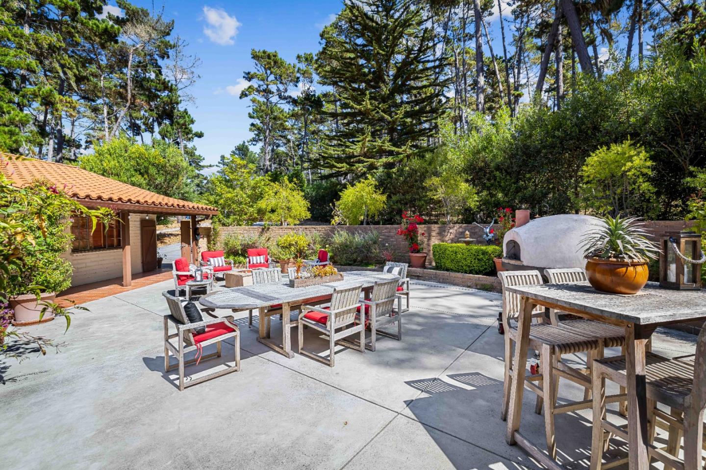 1268 Viscaino Road Pebble Beach, CA 93953 - Photo 35 of 47 a view of backyard with sitting area and slide