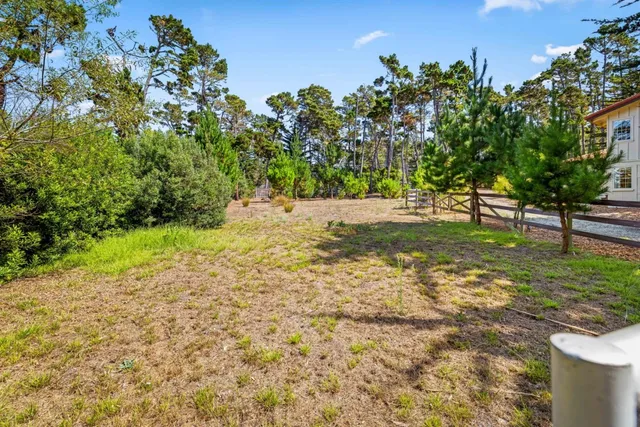 a view of outdoor space with deck and yard