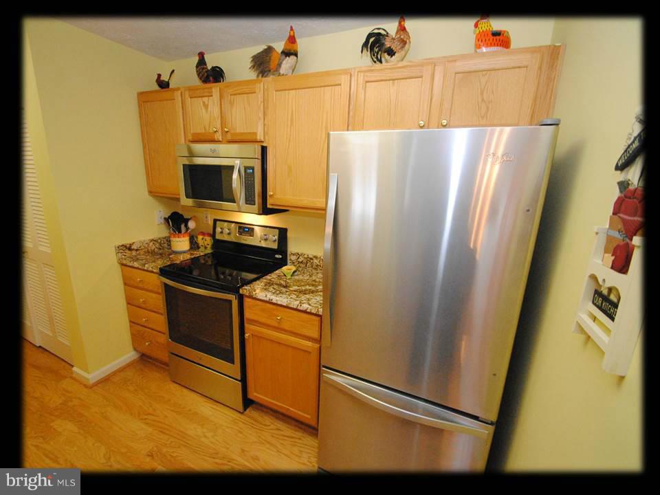 9604 Haven Farm Road, Unit H Perry Hall, MD 21128 - Photo 14 of 27 GRANITE KITCHEN WITH STAINLESS STEEL APPLIANCES