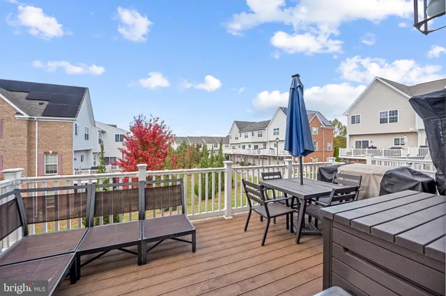 a view of a balcony with furniture