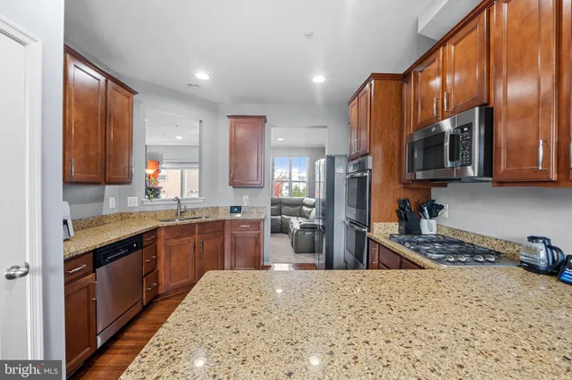 a kitchen with a sink stove and refrigerator