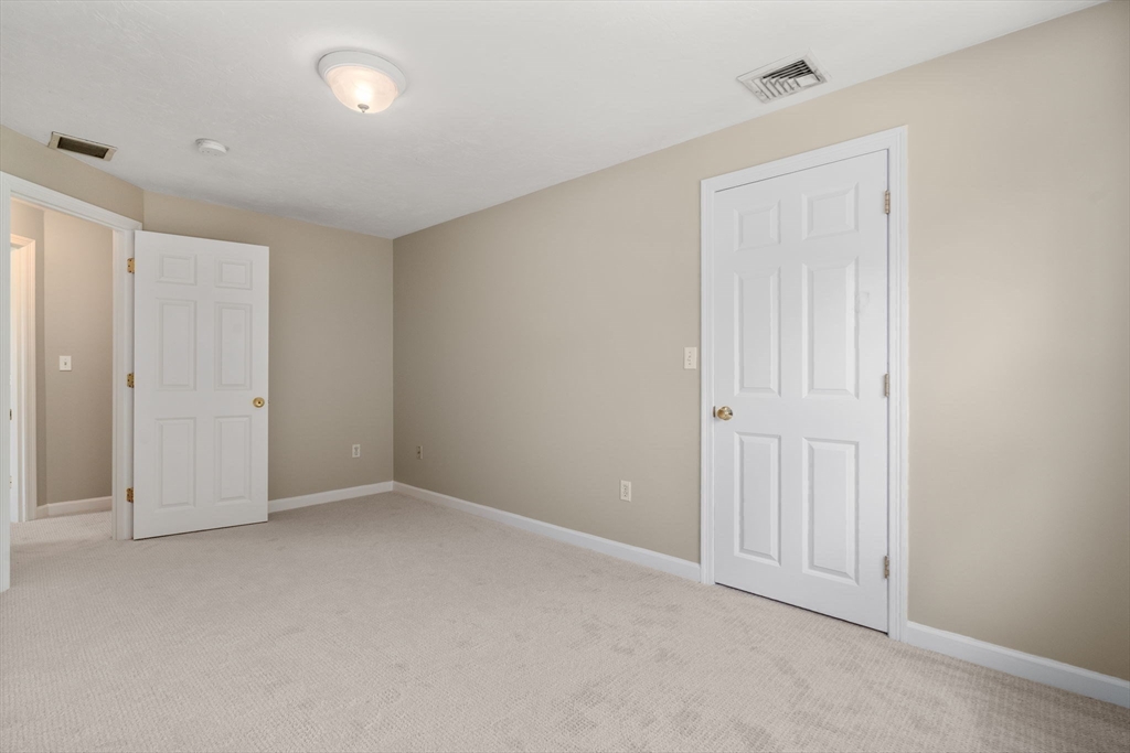 33 Fuller Avenue, Unit 33 Attleboro, MA 02703 - Photo 13 of 16 an empty room with closet area