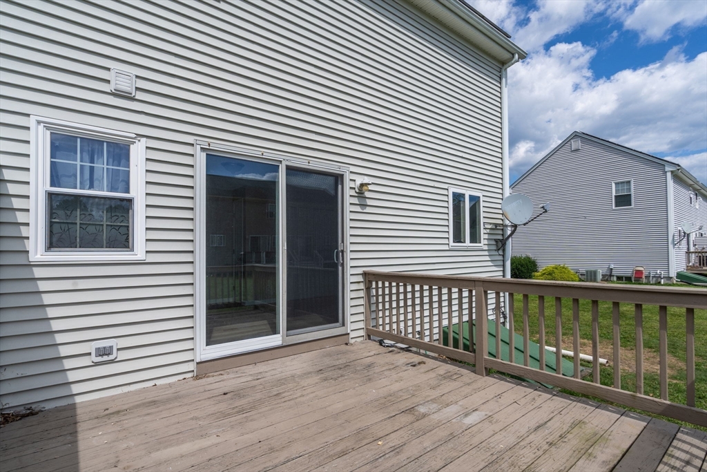 33 Fuller Avenue, Unit 33 Attleboro, MA 02703 - Photo 14 of 16 a view of a wooden deck