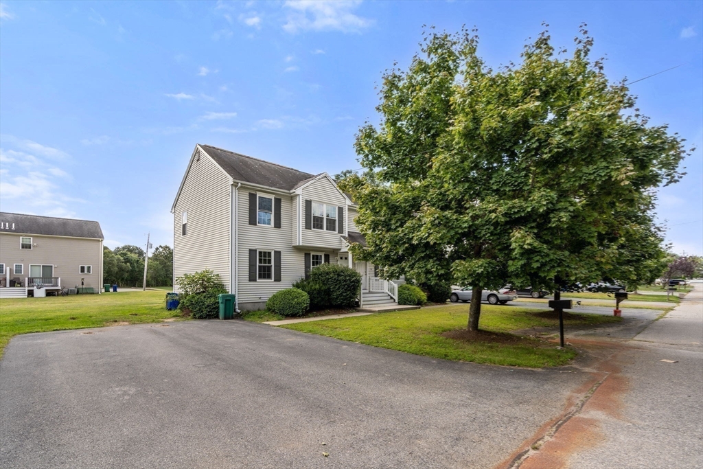 33 Fuller Avenue, Unit 33 Attleboro, MA 02703 - Photo 16 of 16 a front view of a house with a yard and tree s