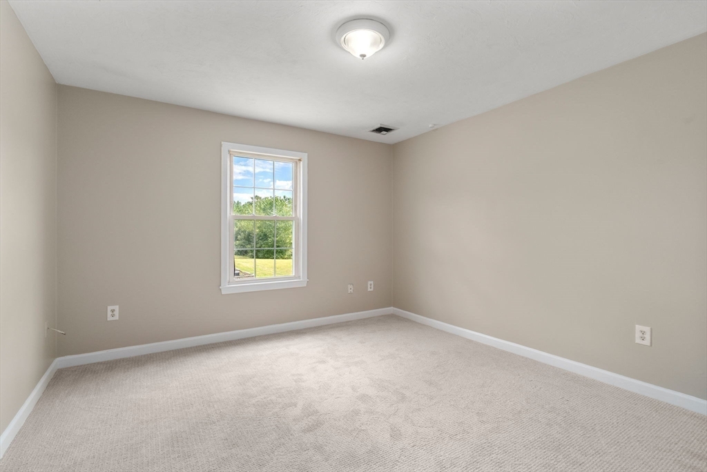 33 Fuller Avenue, Unit 33 Attleboro, MA 02703 - Photo 10 of 16 an empty room with a window