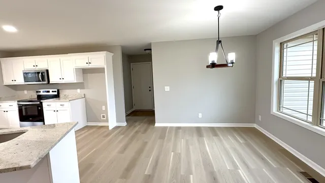 a view of a kitchen and a sink