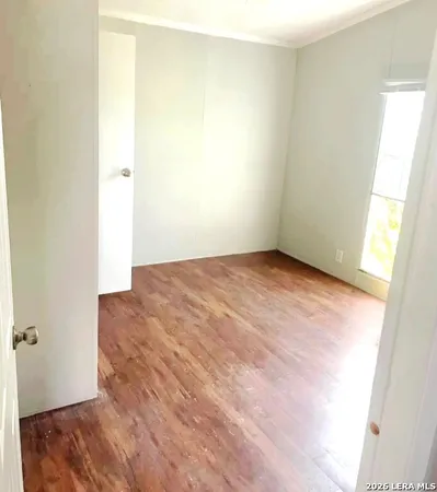 a view of a room with wooden floors and pool