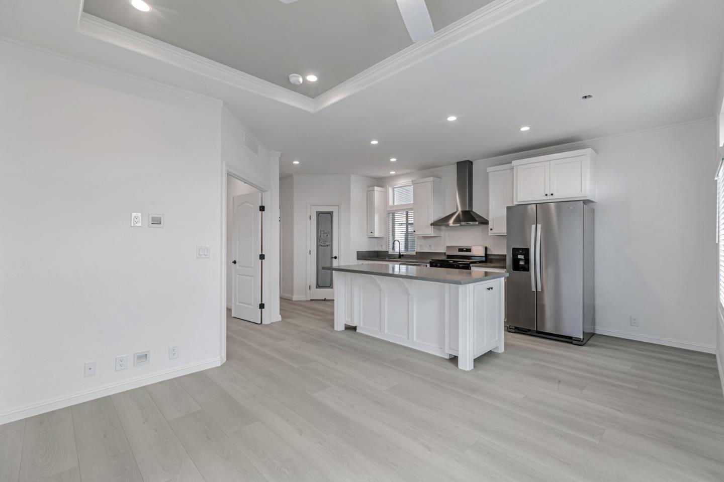 555 Umbarger Road, Unit 131 San Jose, CA 95111 - Photo 15 of 29 a kitchen with stainless steel appliances granite countertop a refrigerator and a stove top oven