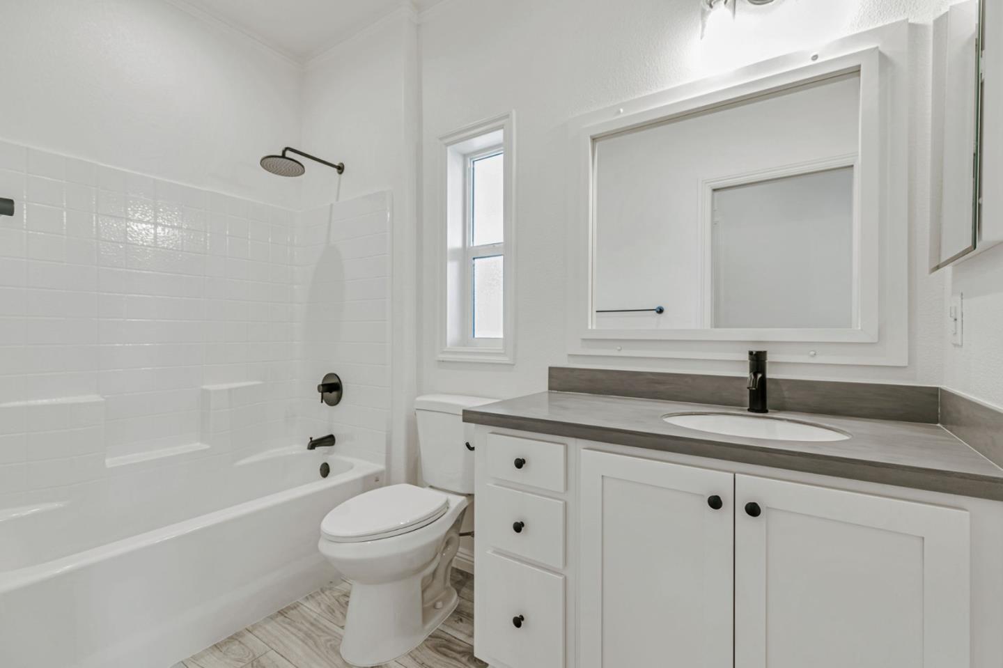 555 Umbarger Road, Unit 131 San Jose, CA 95111 - Photo 22 of 29 a bathroom with a sink a toilet and a bathtub