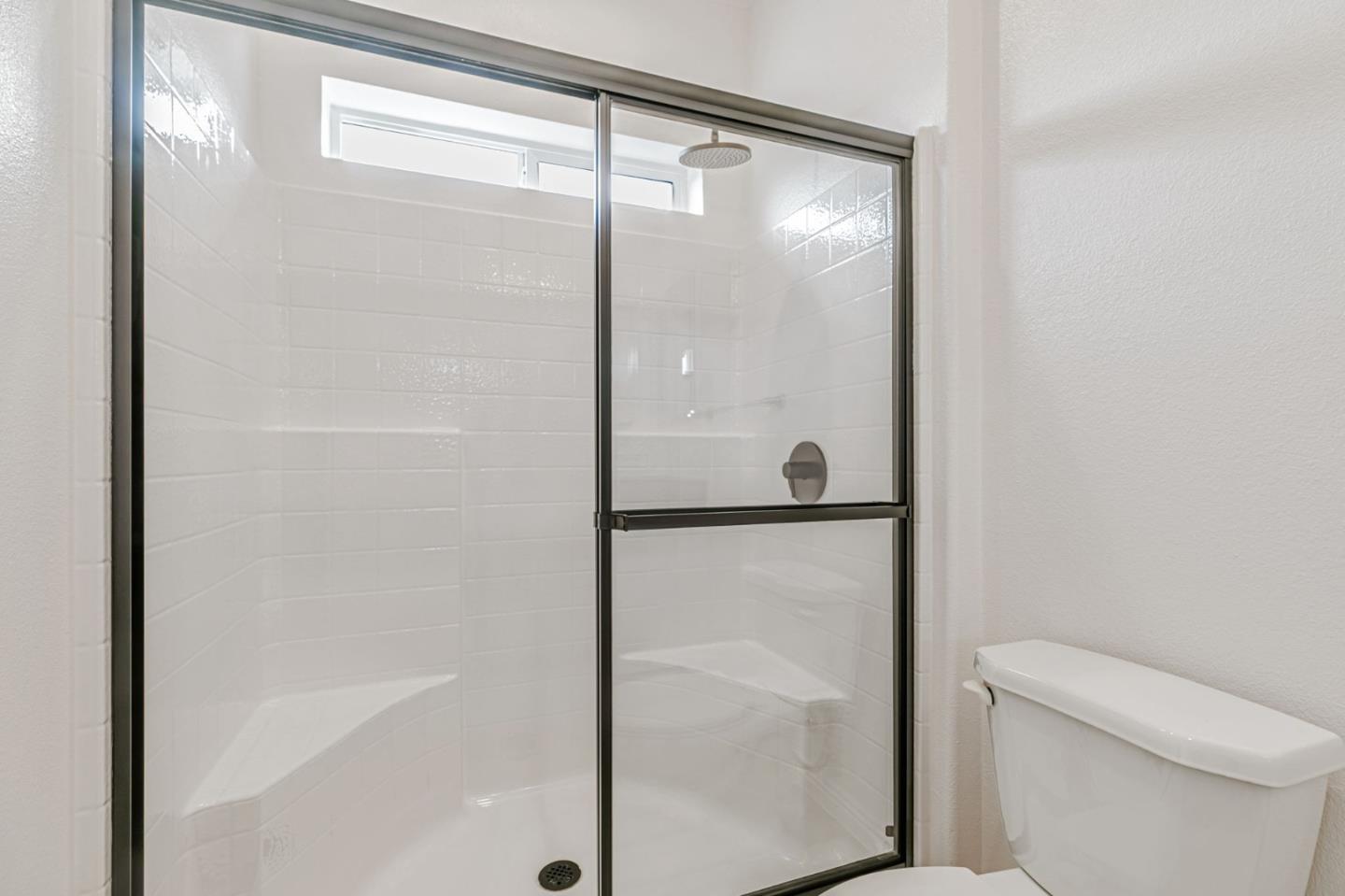 555 Umbarger Road, Unit 131 San Jose, CA 95111 - Photo 25 of 29 a bathroom with a glass shower door